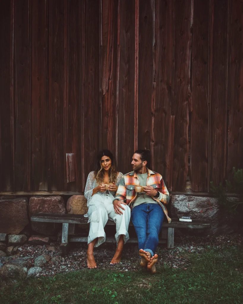 Ari and Benji posing on a bench near the lake in Sweden